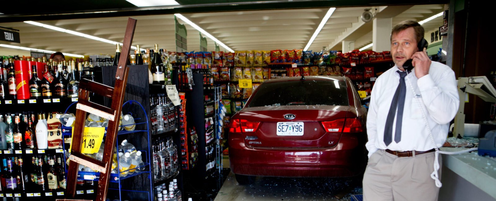 Scottie Anderson, 49, the assistant manager of Ray's Green Hills on North Belt Highway, talks to the store manager on the phone after an accident on Wednesday.